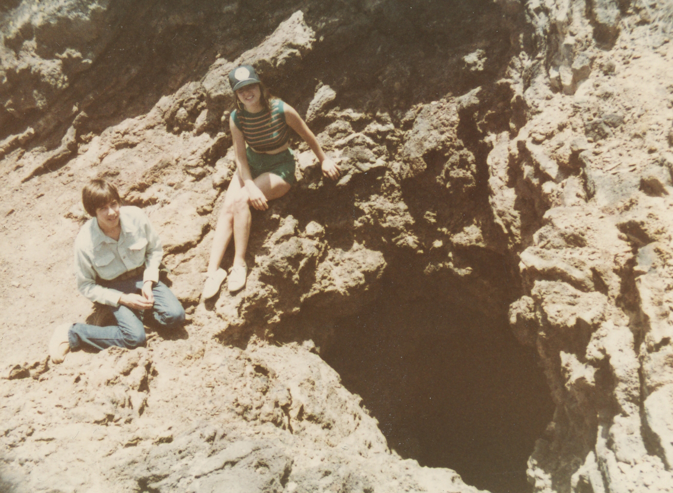 Lito Bujanda-Moore and Ann James Massey beside the fumarole in Aden Crater on a camping trip with Lito's dad and Ann's uncle, Tom Moore. Tom had been a staff cartoonist for Archie comics.
Photo  ©1982 Tom Moore