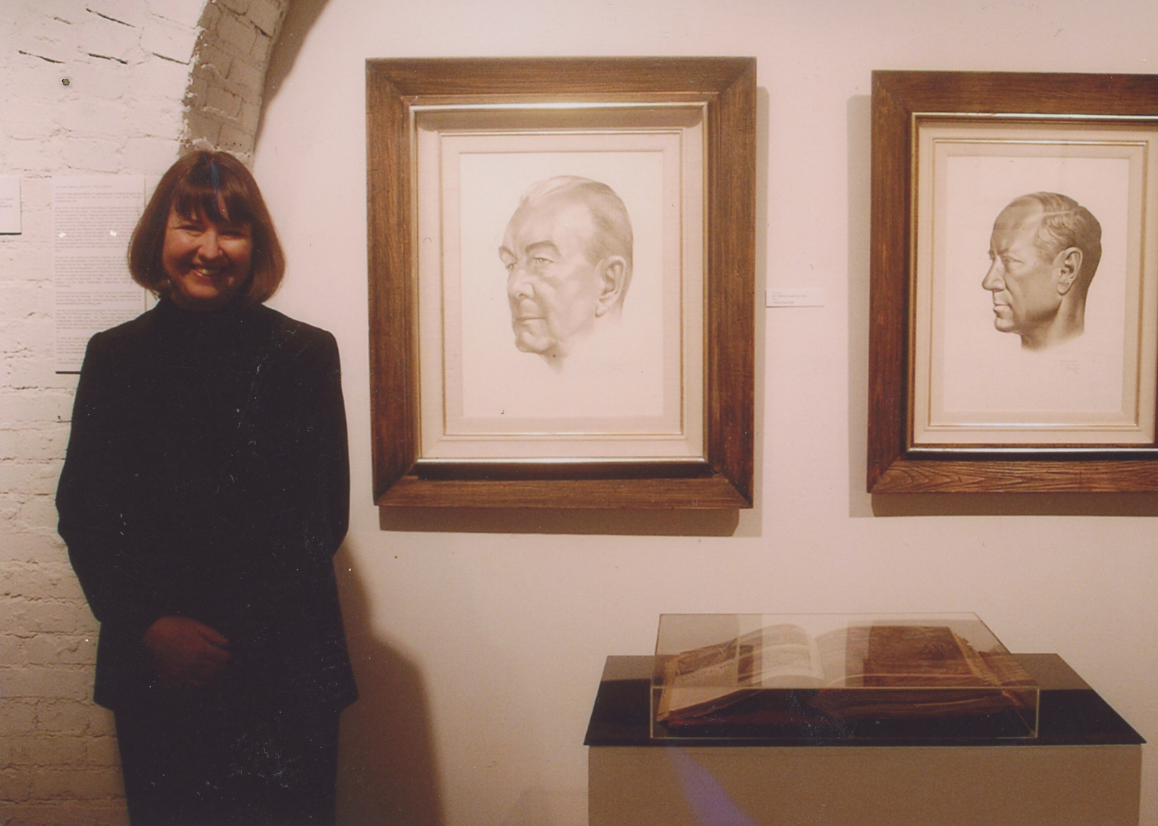 Ann James Massey at a joint exhibition of her work (Impressions of Life: Drawings by Ann James Massey) and Tom Lea’s (Abstraction and Realism: Drawings by Tom Lea) at The Adair Margo Gallery in 2006. Tom’s portrait of her great uncle General James H. Polk is on the left and the one of her great uncle Charles H. Leavell, Jr. is on the right. Below the portraits is her grandmother’s scrapbook opened to the section on Tom Lea.   Photo ©2006 Jody Polk Schwartz
