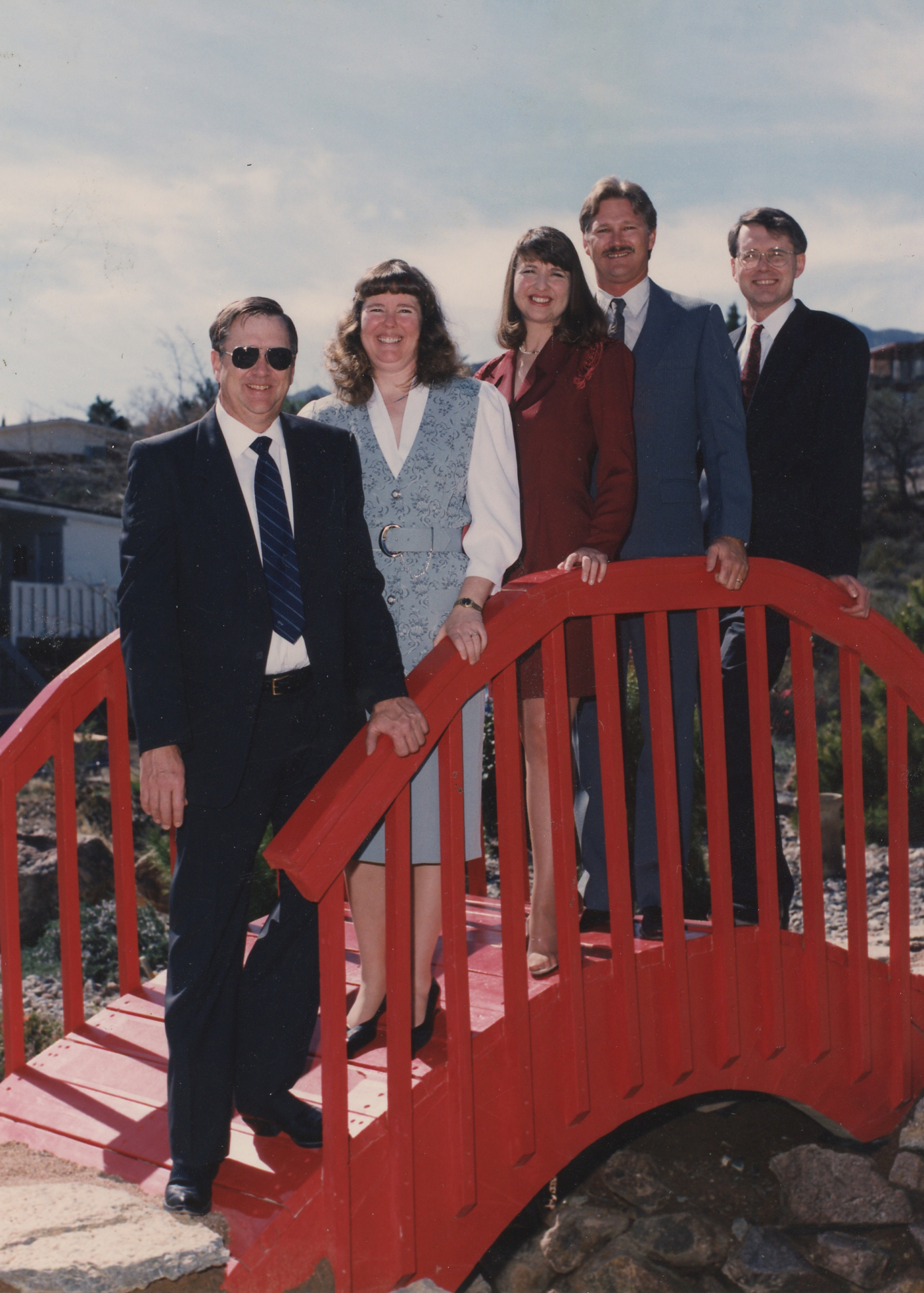 The siblings Frank T. James, Susan Niehans, Ann James Massey, Keith B. James and Paul A. James in 1995 on the bridge our father built over the small ravine in the park across the street from our family home in Mountain Park.