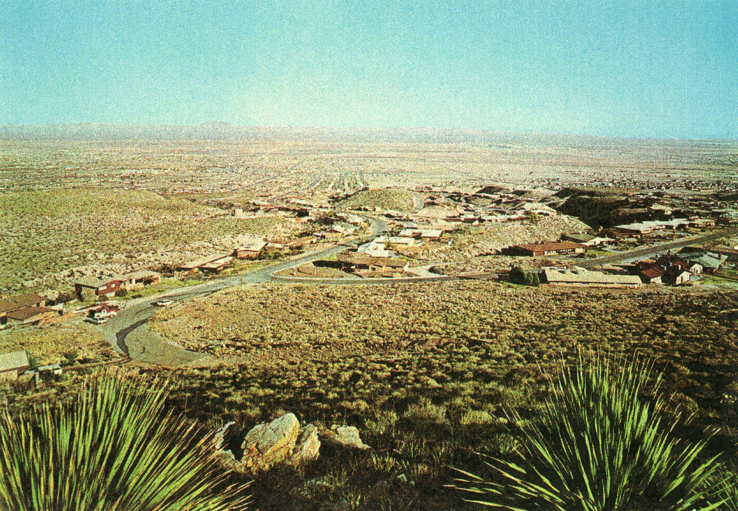 View looking down on Mountain Park and Northeast El Paso in the 60's. Our house is in the upper third middle of the photo seen at the middle bottom of the hill of Devil's Tower.
Photo © Fred K. James  